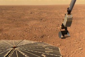 Imagem de Phoenix a reunir amostras do solo de Marte
